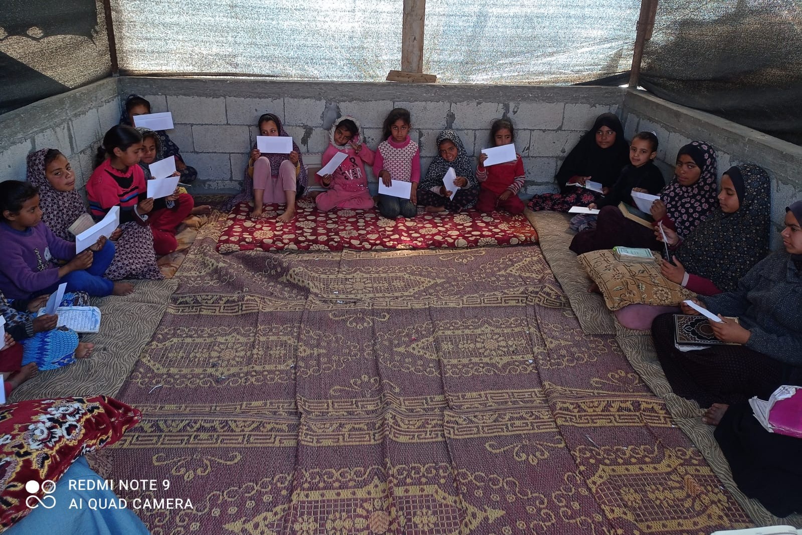 Children in Gaza hold their completed letters.